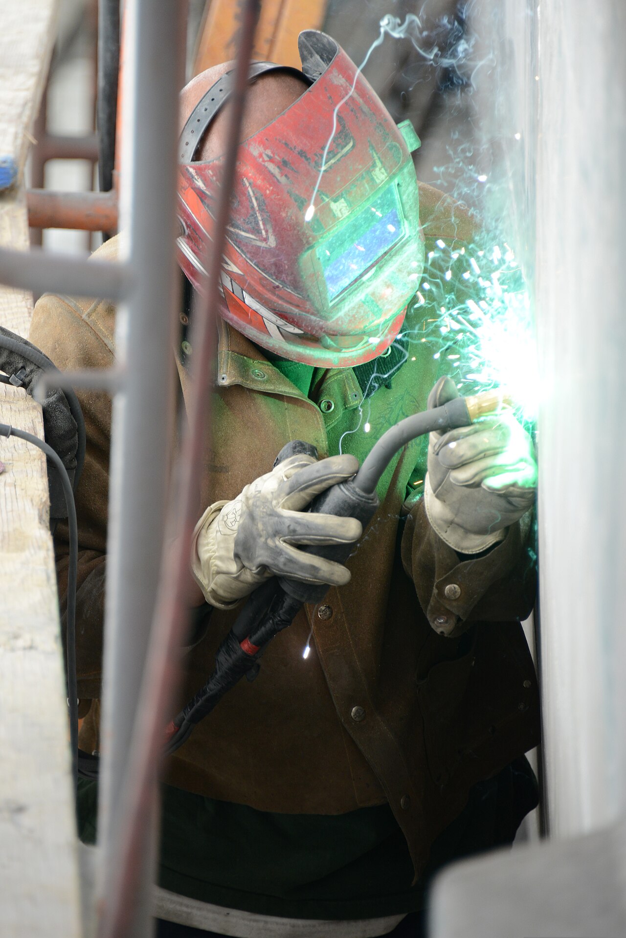 Shipyard welding work being reviewed by inspectors